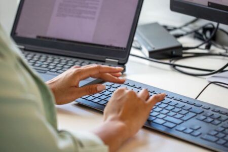 Female typing on laptop