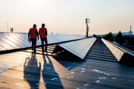 Two engineers working with solar panels