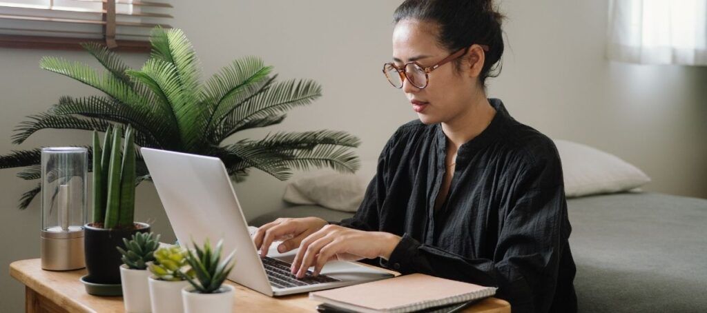 Woman on laptop searching for job