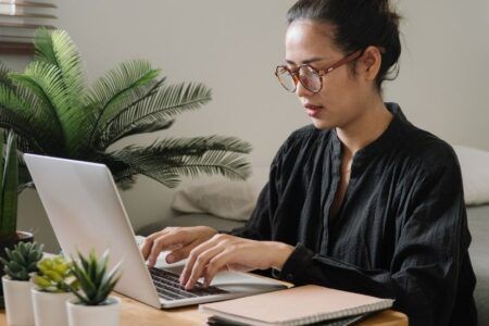 Woman on laptop searching for job